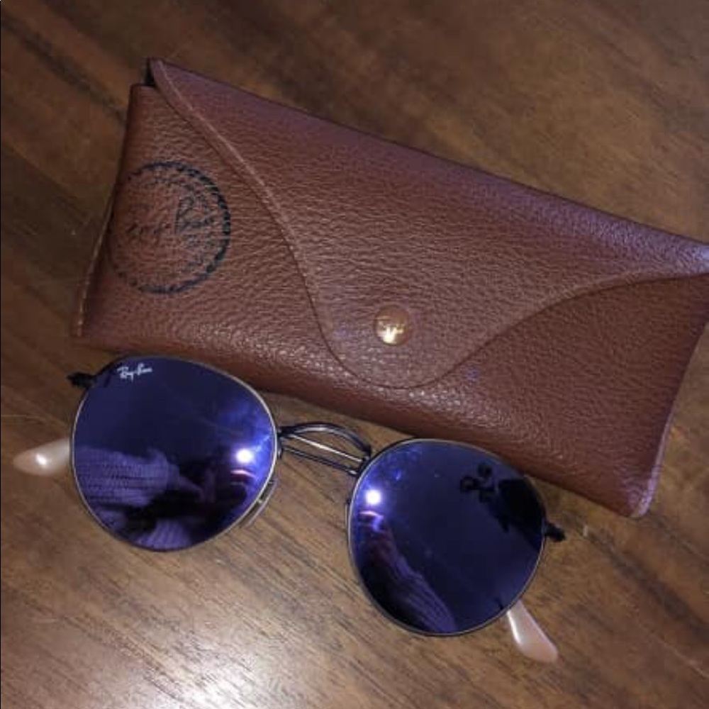 Purple round RayBans.